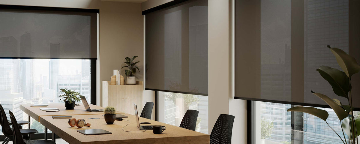 Screen-fabric roller blinds in an office meeting room
