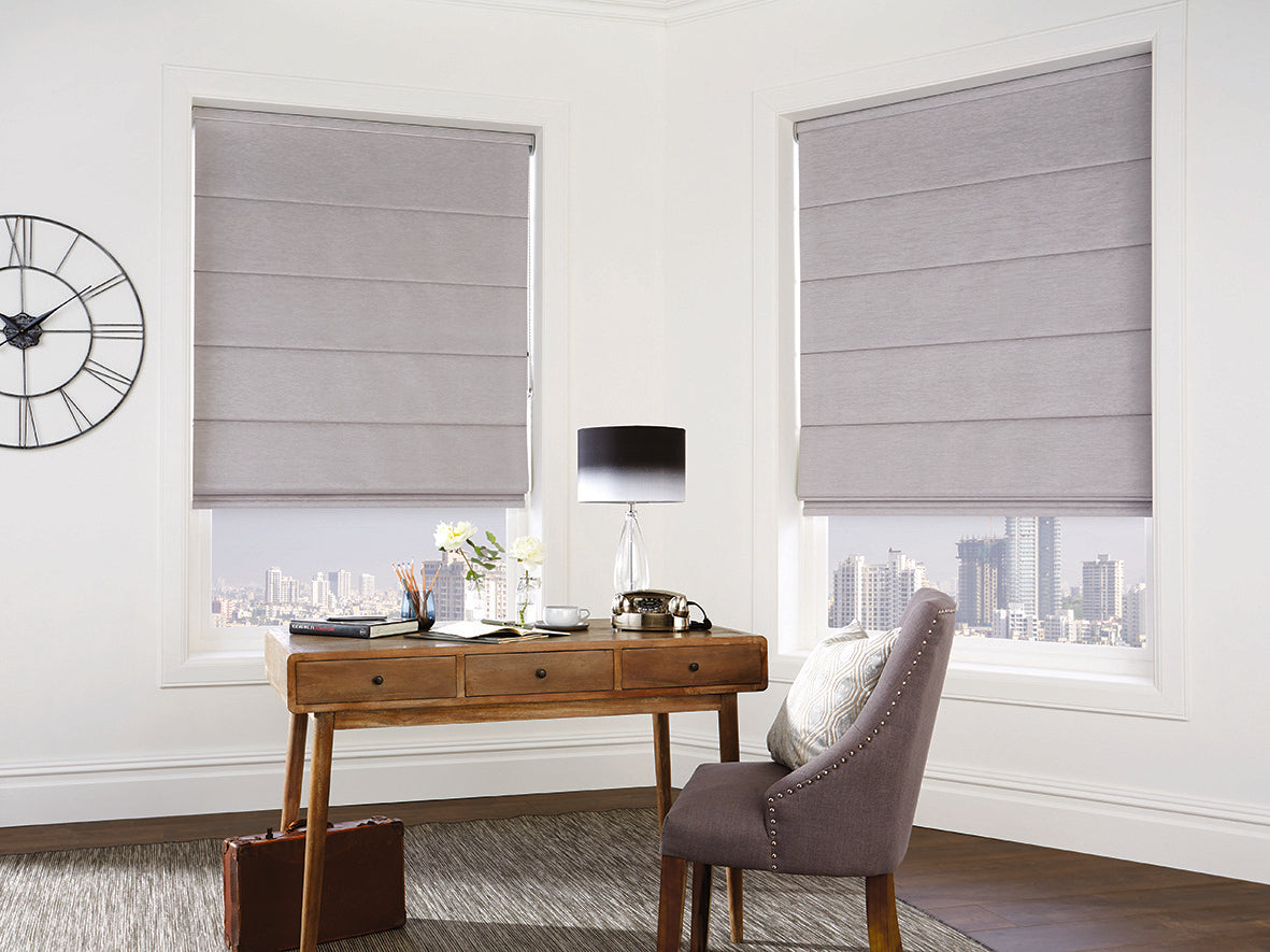 Silver chenille Roman blind in a study