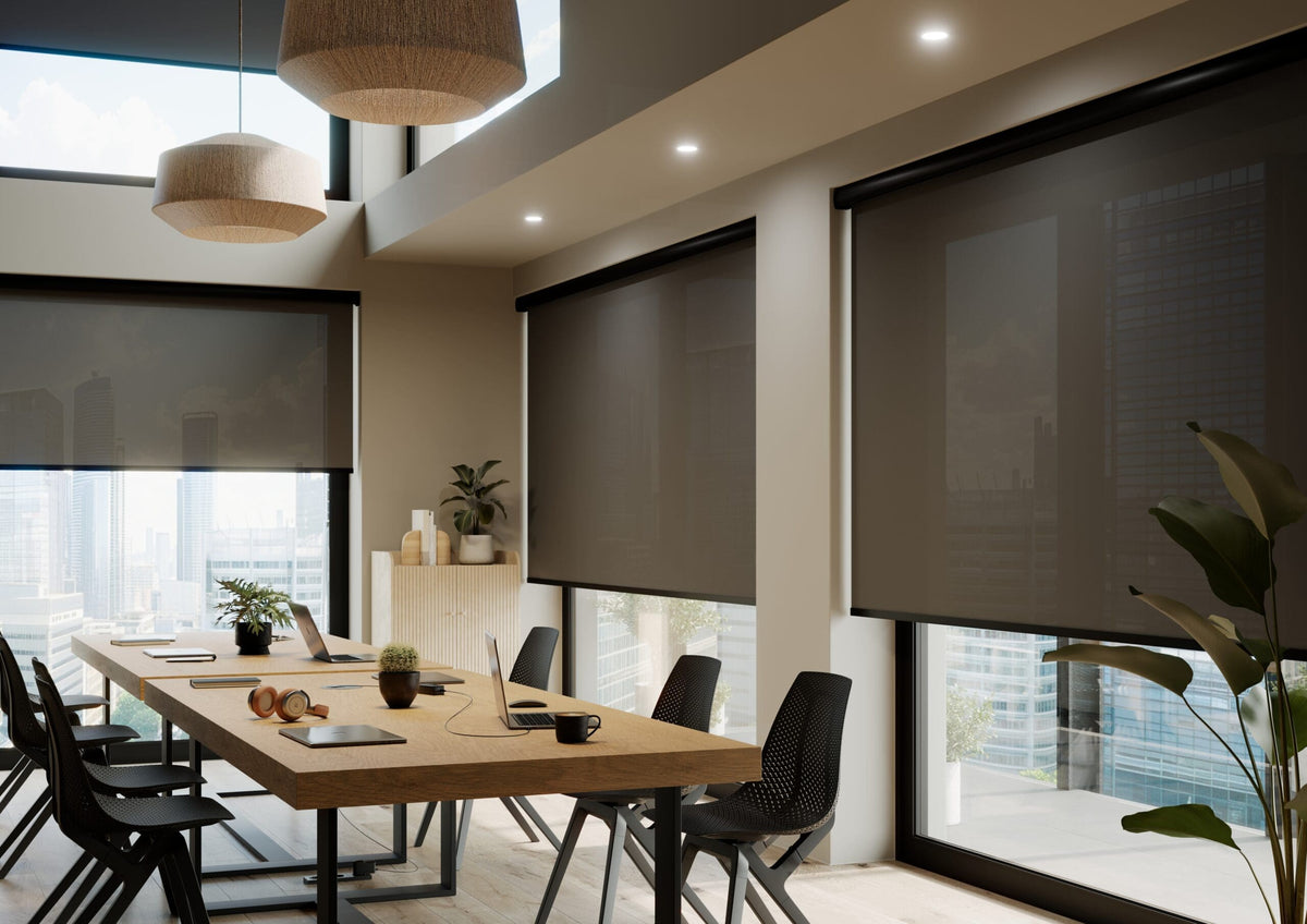 Charcoal screen-fabric roller blinds shading large windows